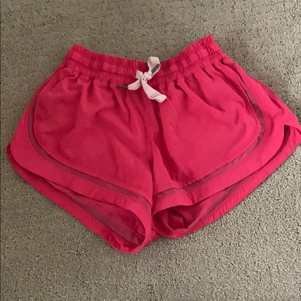 Pink lululemon workout shorts.